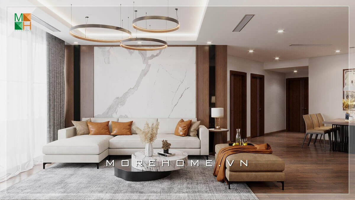 Một bộ sofa gỗ bọc nỉ chữ L, một bàn trà bằng đá nhân tạo với đèn thả kiểu cách, vách tường đá kết hợp cùng gỗ, tất cả tổng thể tạo nên một căn phòng khách vô cùng ấn tượng, thể hiện gu thẩm mỹ tinh tế của gia chủ Mẫu nội thất chung cư hiện đại