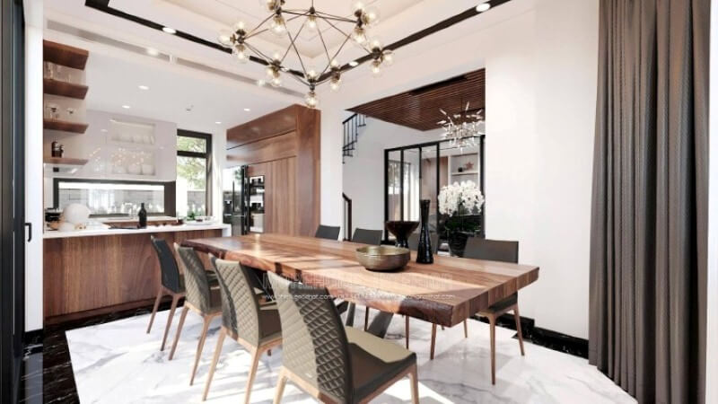 Ngoài điểm đặc biệt từ cách bố trí kệ trang trí, bàn đảo bằng đá nhân tạo màu trắng được thiết kế nhô ra ngoài lại là điểm đáng chú ý, một mặt vẫn đảm bảo diện tích để chủ nhân có thể phô diễn món ăn thỏa mái, một mặt bạn lại có thể vừa nội trợ vừa có thể để mắt con học một cách dễ dàng. Tủ bếp