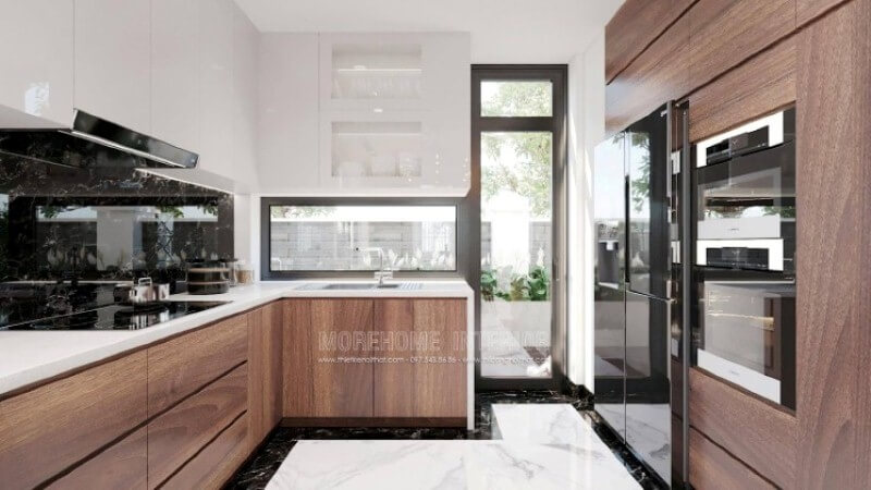 Nếu bạn đã được xem các mẫu tủ bếp đẹp có tay nắm, thì có thể những mẫu tủ bếp đó đã lỗi thời, thiết kế phòng bếp với toàn bộ bề mặt cánh tủ trơn nhẵn là một sự đổi mới hoàn hảo, không chút tay cầm nhưng lại kéo đẩy dễ dàng nhờ ý tưởng thiết kế vát từ cánh tủ giúp bề mặt gọn gàng mà đẹp mắt. Thiết kế tủ bếp biệt thự sang trọng