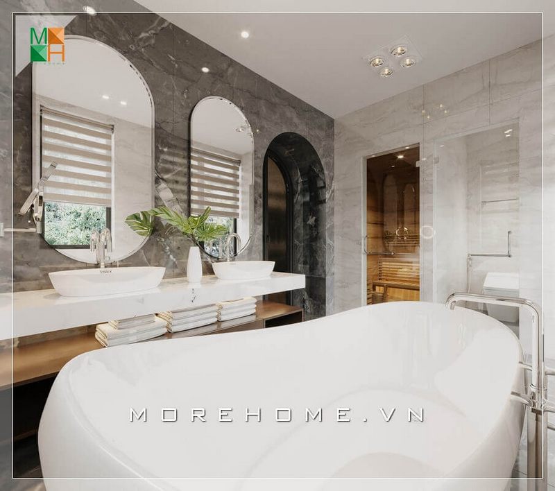 Phòng tắm sử dụng đá ốp tường màu đen vân trắng tương phản với lavabo trắng, mang đến không gian thư giãn cá nhân vô cùng sang chảnh